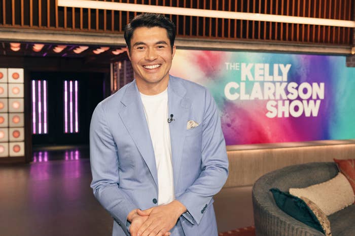 Henry Golding smiles in a blue blazer on &#x27;The Kelly Clarkson Show&#x27;