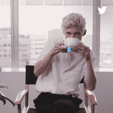 Troye Sivan sipping from a bowl