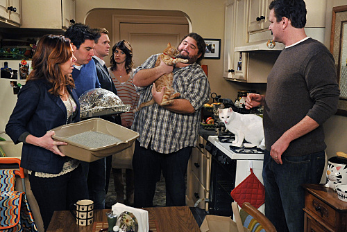 Five characters from &quot;The Big Bang Theory&quot; in a kitchen with Sheldon holding a cat