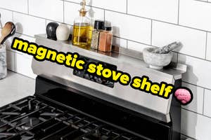 A magnetic stove shelf holding spices and utensils in a kitchen setting