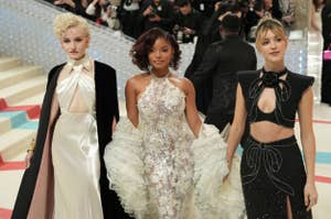 Julia Garner, Halle Bailey, and Daisy Edgar-Jones in glamorous dresses at a formal event, with unique necklines and embellishments