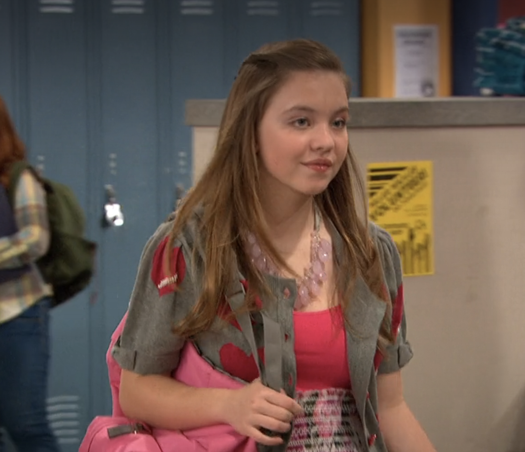 Sydney in a dress and blazer with a backpack in a school scene from &quot;Kickin&#x27; It&quot;