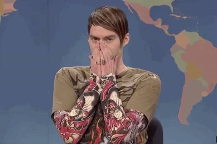 Person with hands covering mouth on SNL&#x27;s Weekend Update set