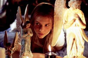 Claire Danes as Juliet among angel statues in a scene from the film 'Romeo + Juliet'