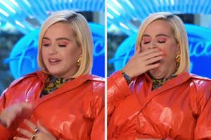Katy Perry in a shiny red outfit laughs and covers her mouth on the American Idol set