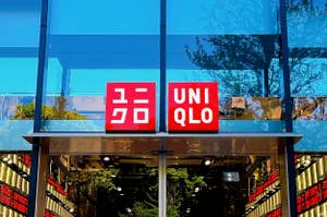 Storefront of UNIQLO clothing store with logo and entrance visible