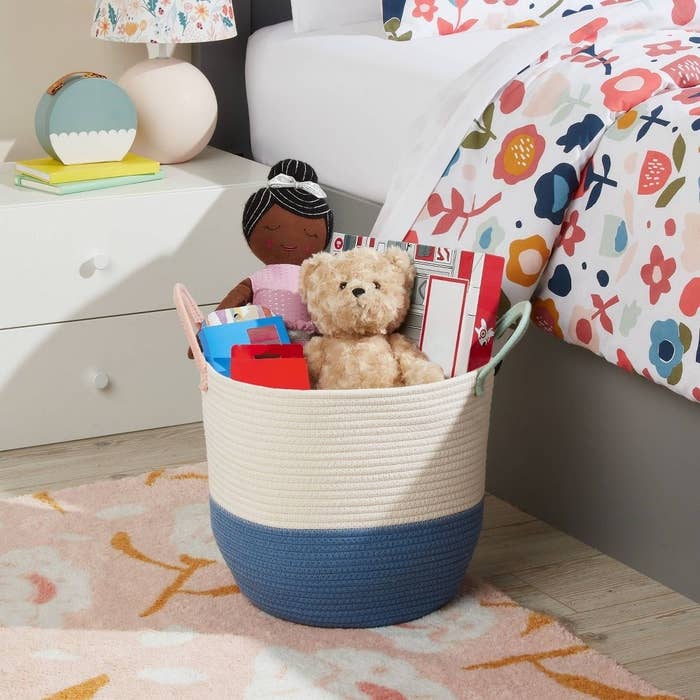 Woven basket with toys and books for a child&#x27;s room decor, showcasing organization options for shoppers