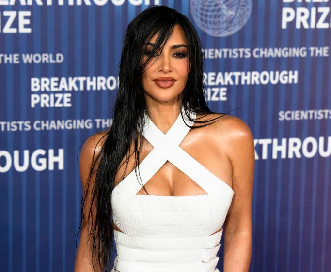 Kim Kardashian in a white crossover neckline dress at the Breakthrough Prize ceremony