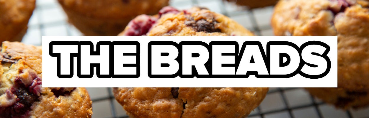 Freshly baked muffins on a cooling rack with the words &quot;THE BREADS&quot; overlaid