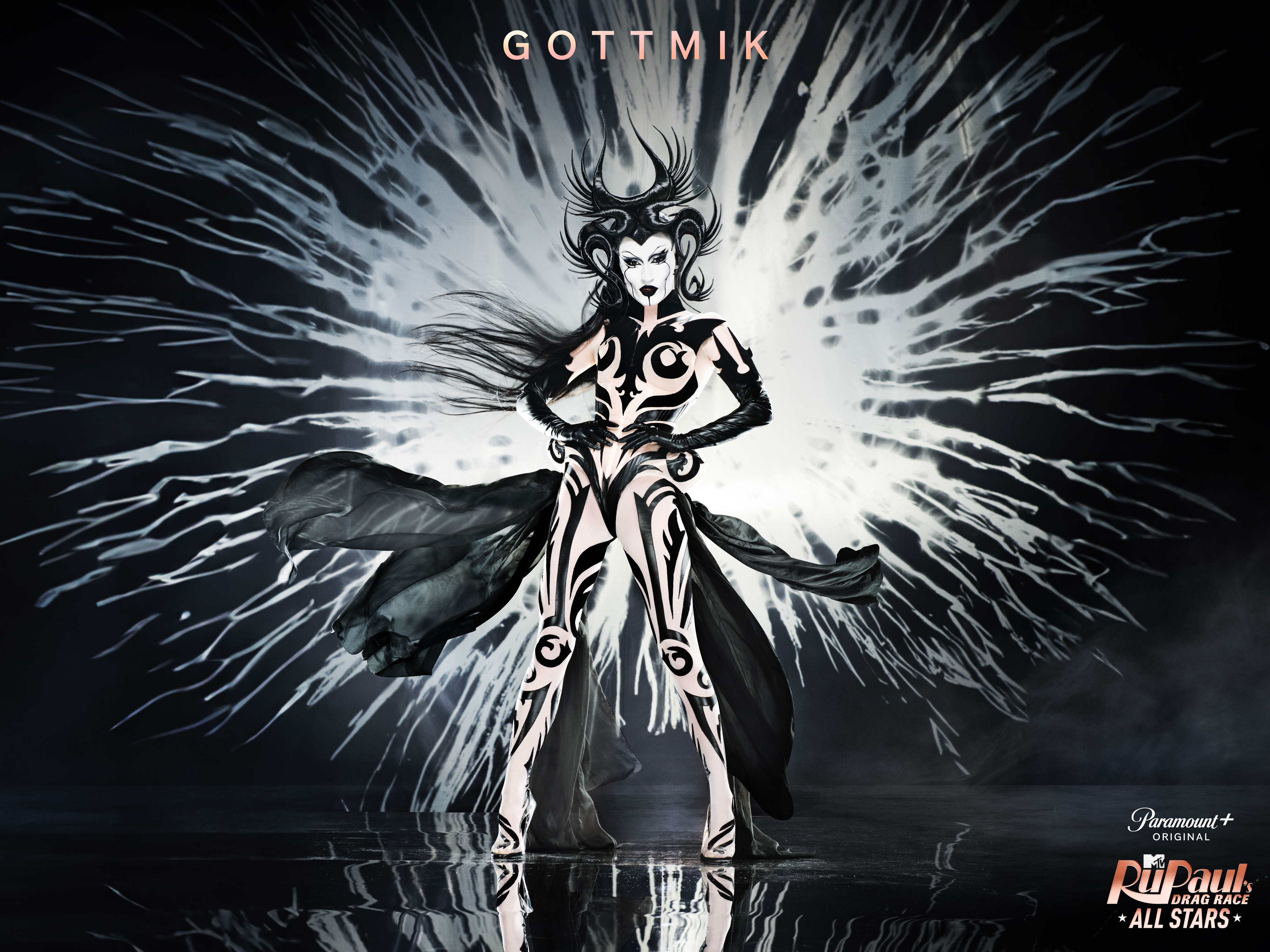 Gottmik in dramatic black and white outfit with splatter design