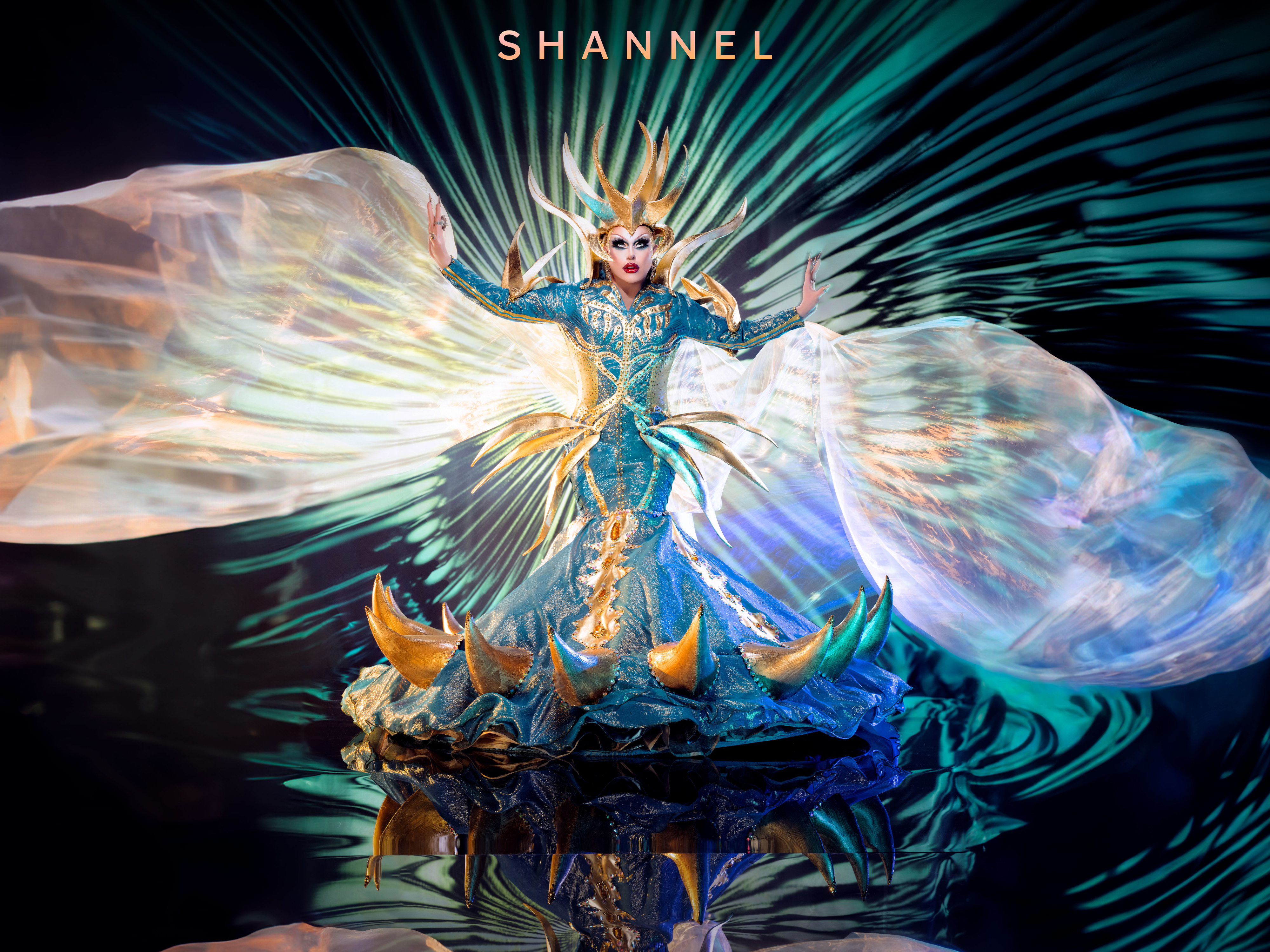 Shannel in an elaborate blue costume with an ornate headpiece