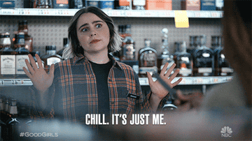 Woman with surprised expression, hands up, text: &quot;CHILL. IT&#x27;S JUST ME.&quot; #GoodGirls show