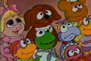Group of Muppet Babies characters smiling together, including Baby Kermit and Baby Piggy