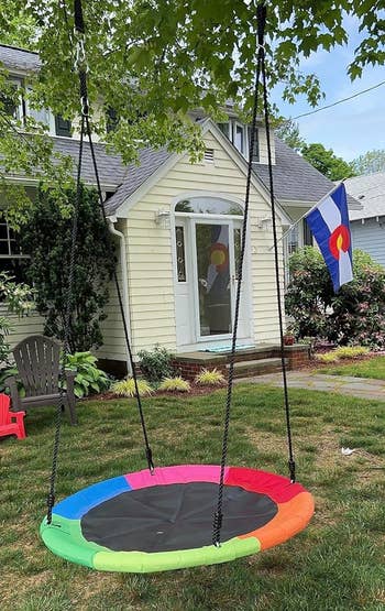 Round plaything hanging successful a gait with a location and emblem successful the background