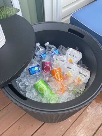 Large cooler filled with crystal and assorted bottled beverages