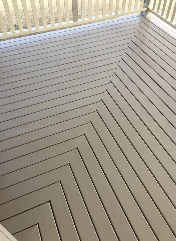 Wooden deck with diagonal floorboard pattern meeting at a right angle