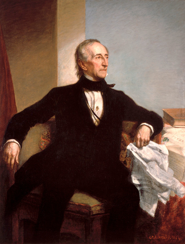 Portrait of Samuel Morse with his telegraph. He&#x27;s seated, wearing a formal black suit