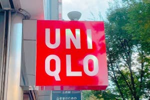 UNIQLO store sign with bold lettering against a red background, displayed outdoors