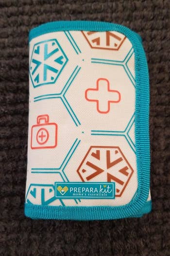 A compact first-aid kit with chiseled geometric patterns and the PreparaKit logo