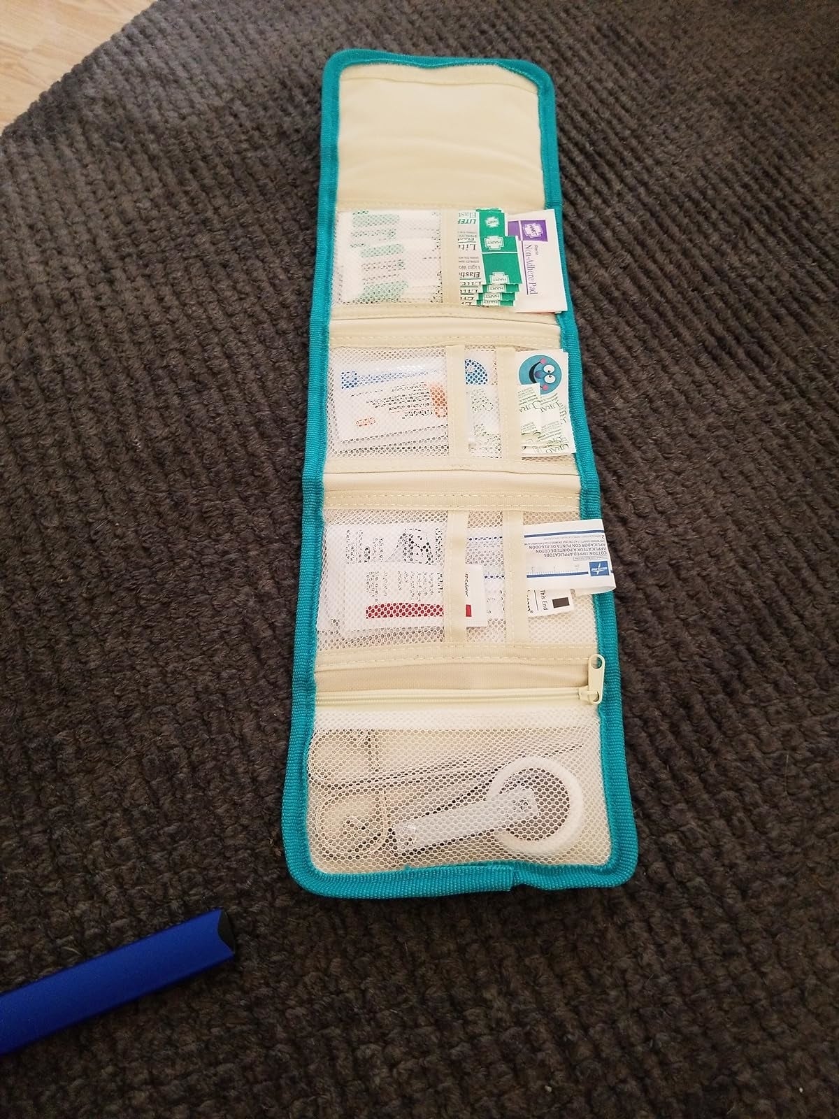 A question   organizer laid retired  with assorted  compartments, immoderate   holding cards and travel-sized items