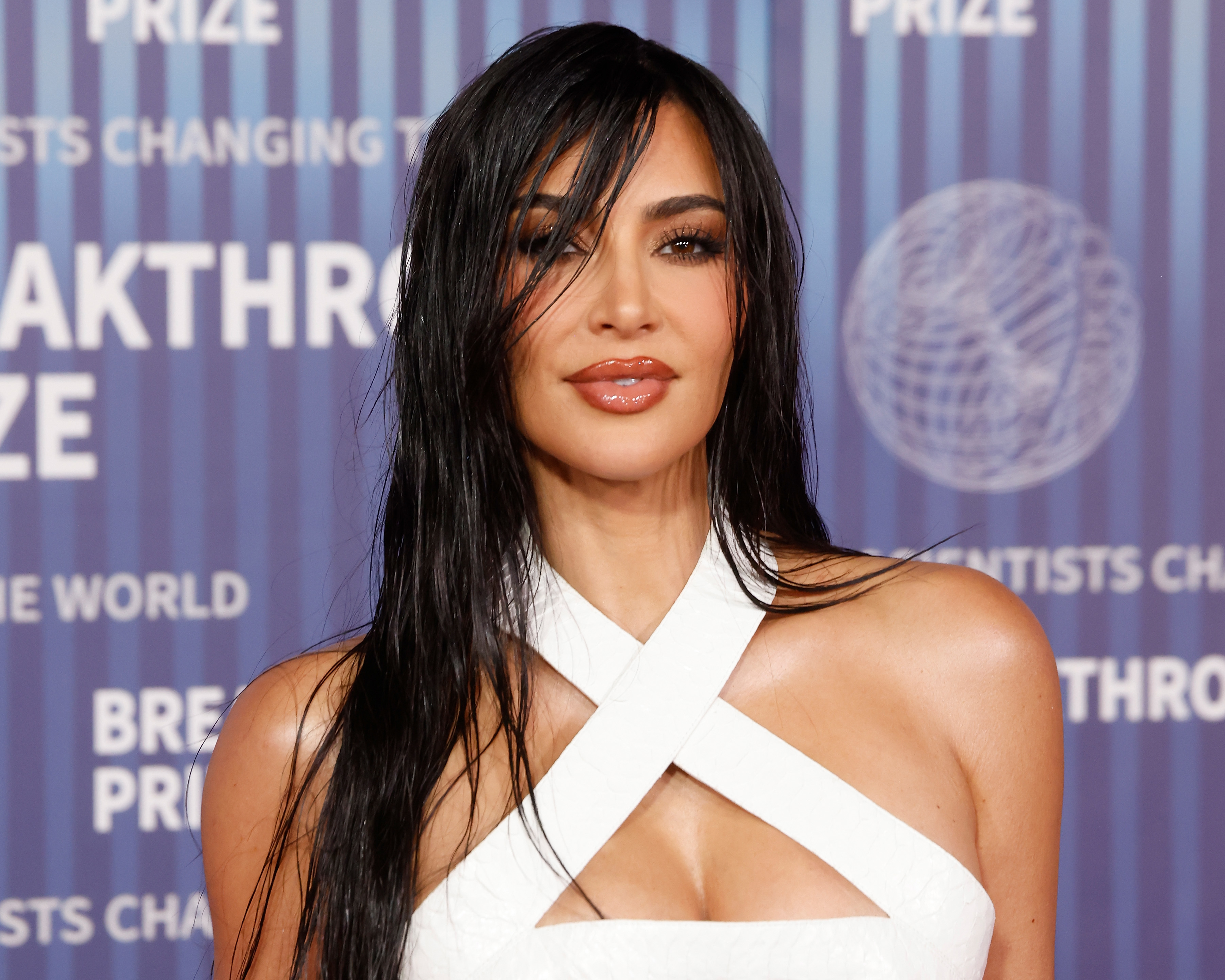 Kim Kardashian in a white crisscross top at a breakthrough event