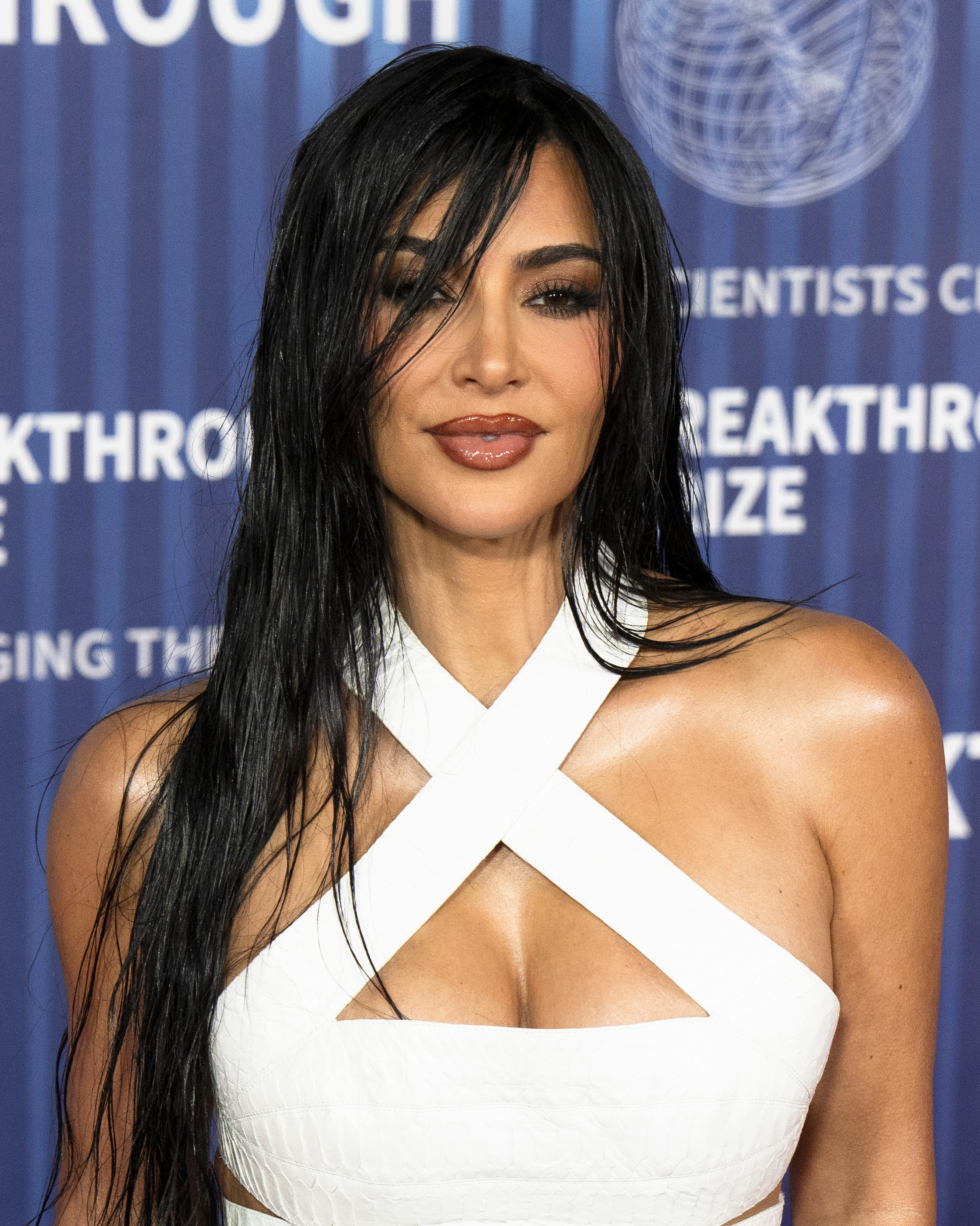 Kim Kardashian wearing a white crisscross top at the Breakthrough Prize ceremony