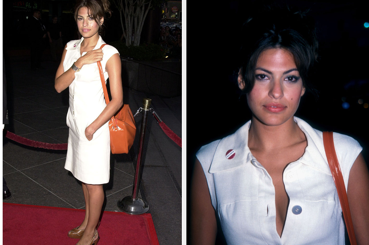 Eva Mendes on a red carpet in a chic sleeveless white dress with a collar and a shoulder bag