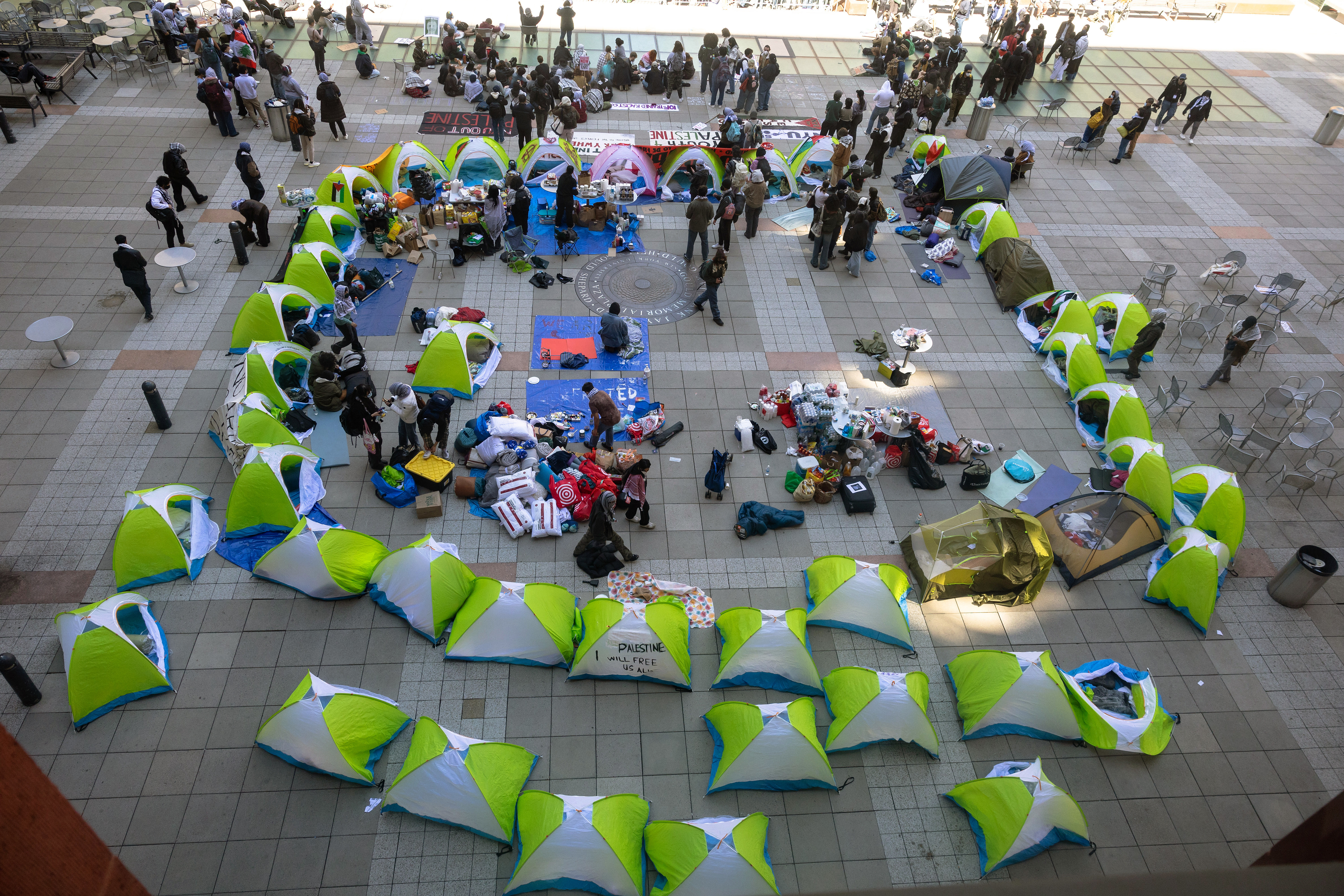 Aerial view of a public outdoor lounging area with arranged bean bags and small groups of people
