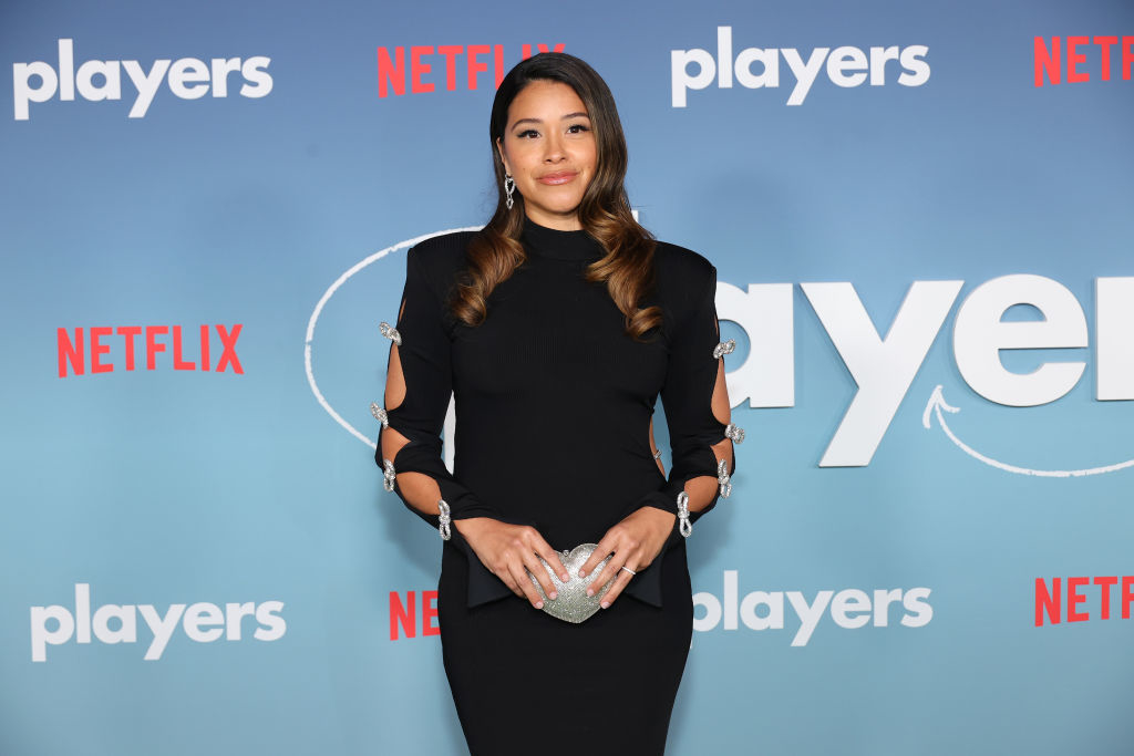 Gina Rodriguez in a dress with cut-out details at a Netflix event