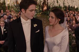 Edward and Bella looking at each other at their wedding.