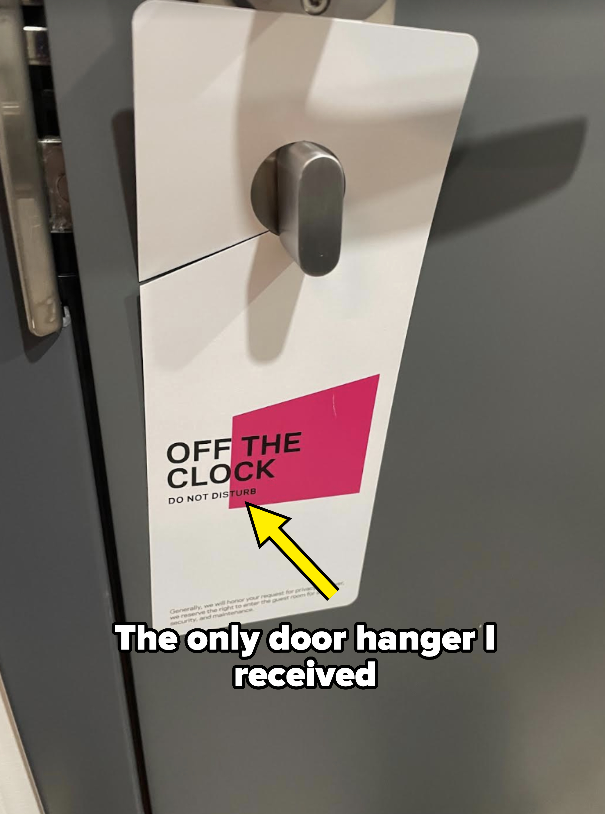 Door hanger on a handle reads &#x27;OFF THE CLOCK&#x27; indicating &#x27;Do Not Disturb&#x27; at a travel accommodation