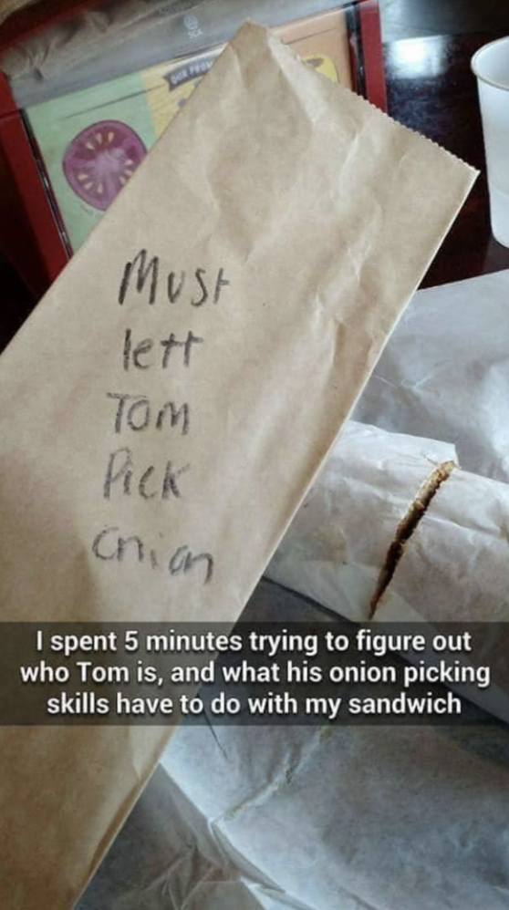 Handwritten note that says, &quot;Must lett Tom pick an&quot; on a sandwich bag, with humorous commentary on figuring out its meaning