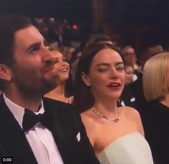 Closeup of Dave McCary and Emma Stone at the Oscars