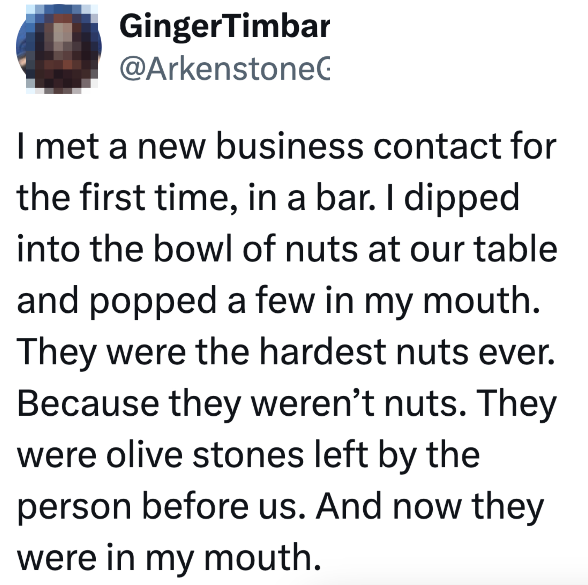 Tweet describes a humorous mix-up where the user mistook decorative stones for nuts at a bar