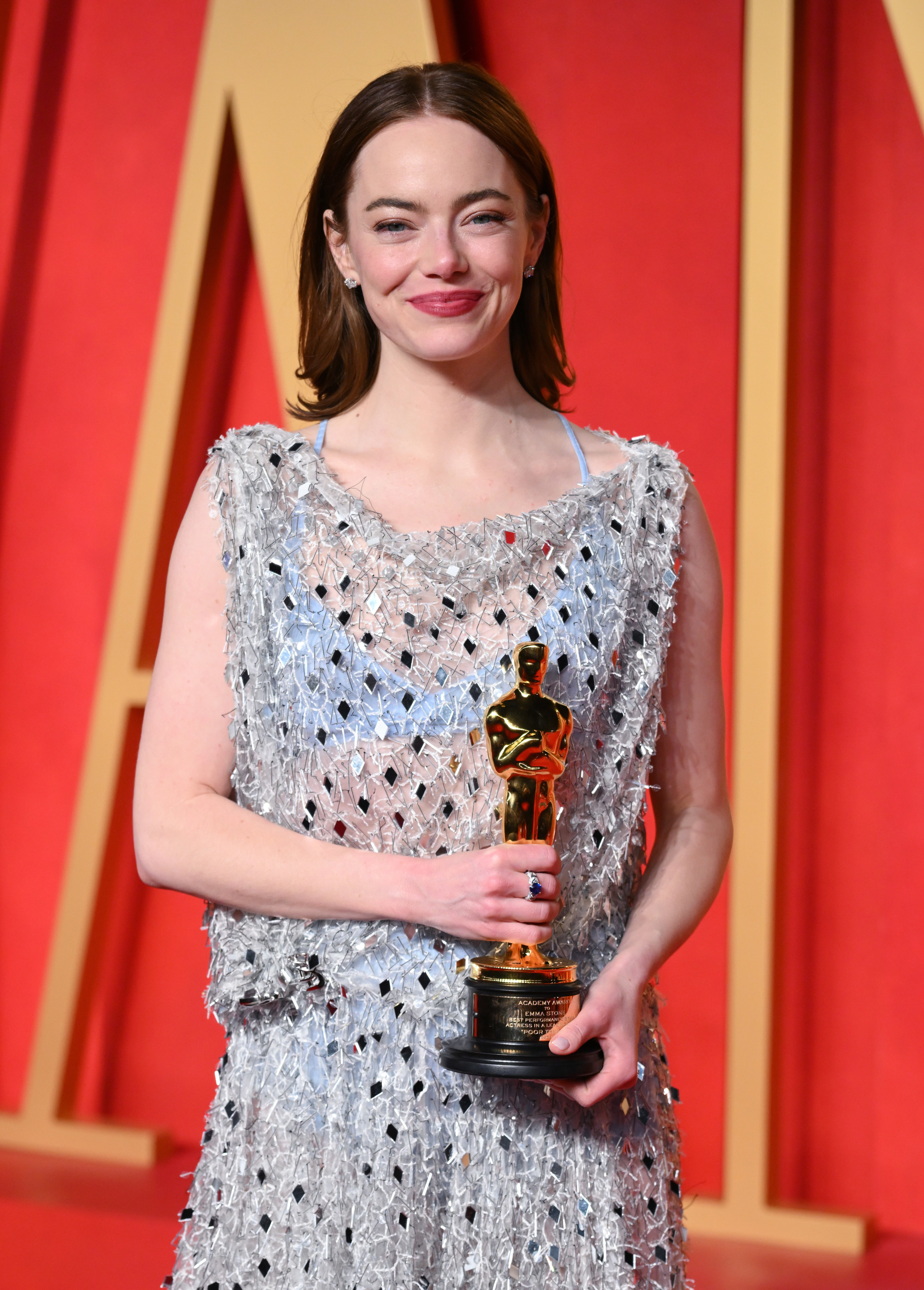 Emma Stone holding her Oscar
