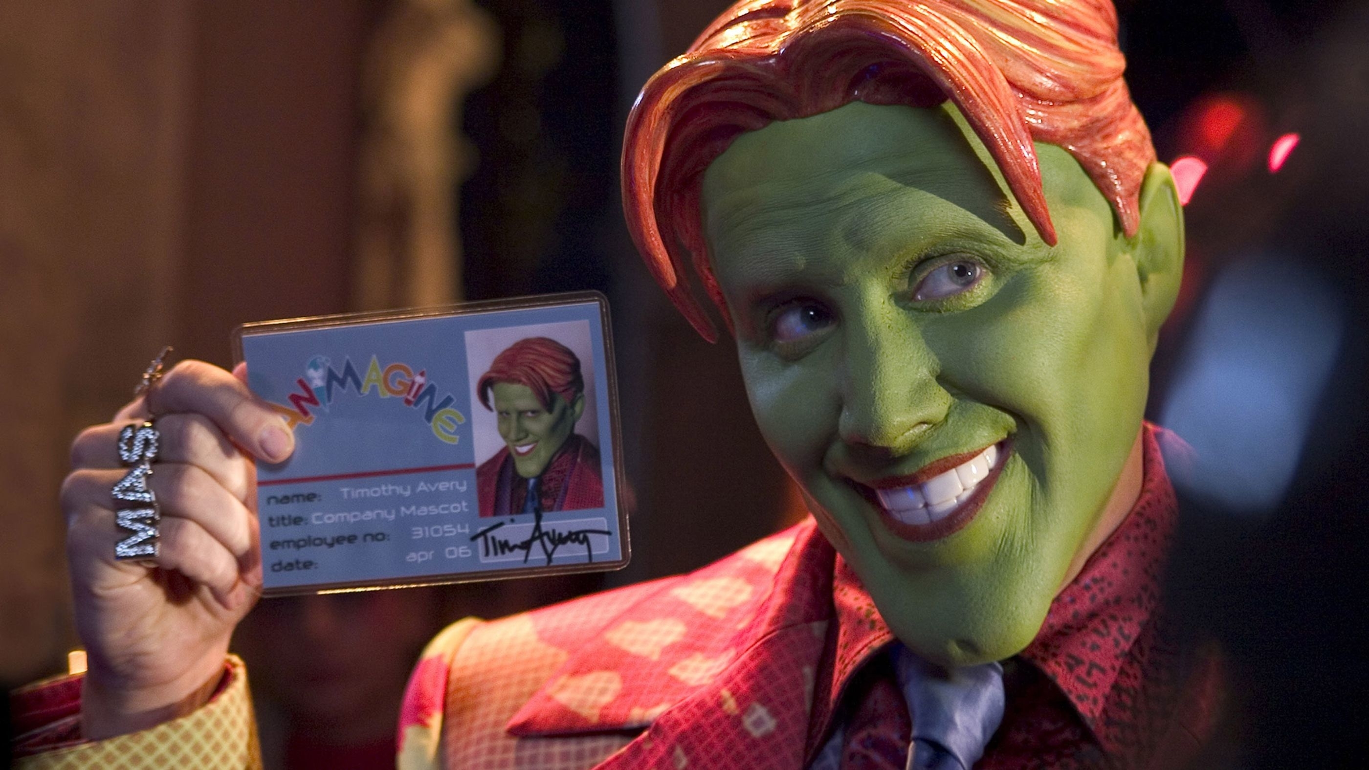 The Mask character, portrayed by Jim Carrey, holding up a humorous ID card