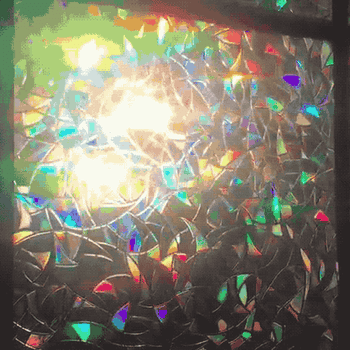 reviewer gif of the movie  installed creating rainbow effect   with the airy  coming through