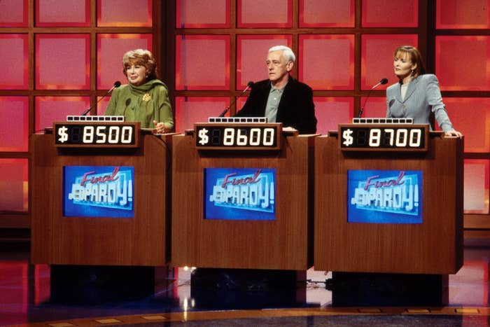 Three contestants at Jeopardy! podiums with their scores displayed