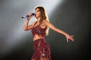 Taylor Swift singing in a two piece red dress