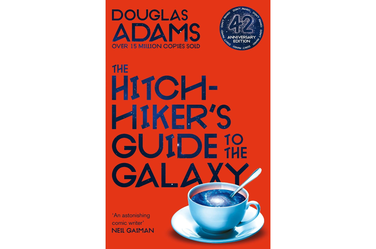 Cover of &quot;The Hitchhiker&#x27;s Guide to the Galaxy&quot; with title and author Douglas Adams, featuring a cup on a saucer