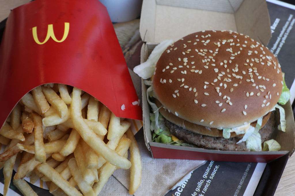 McDonald&#x27;s meal with fries and a Big Mac burger in open packaging