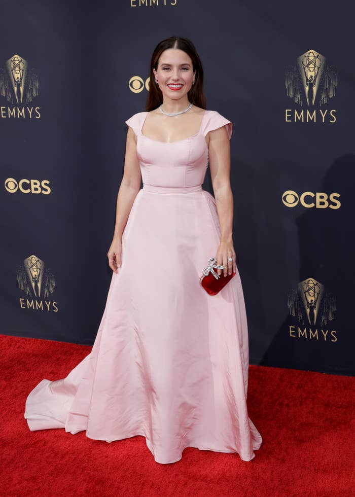 Sophia Bush in a light pink, square-neckline gown with cap sleeves and a flowing train at the Emmys