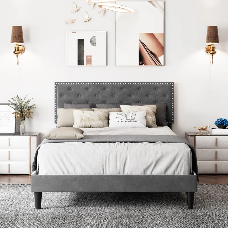 the bed in grey in a bedroom