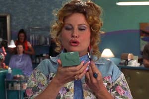 Jennifer Coolidge putting on lipgloss in "Legally Blonde."