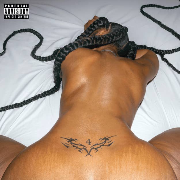 Rihanna poses with her back to the camera, showcasing a tattoo, for her "Anti" album cover