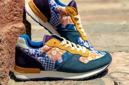 A pair of trendy sneakers with patterned design on a sidewalk