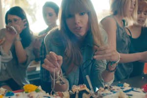 Taylor Swift eating cake in the 22 music video