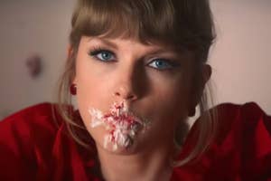 Taylor Swift with frosting on her face in the I Bet You Think About Me music video