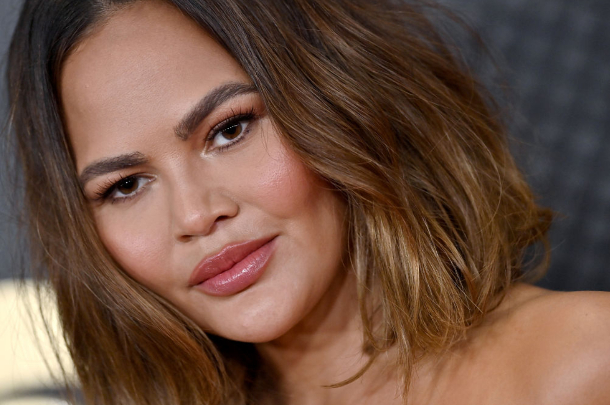 Thanks To A Gust Of Wind, Chrissy Teigen Nearly Flashed The Photographers At A Red Carpet Event But Laughed It Off With A Mom Joke