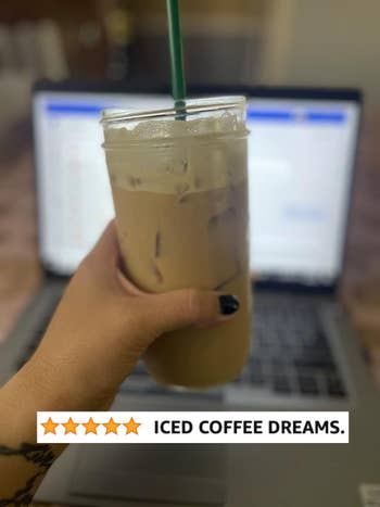 reviewer holding iced coffee